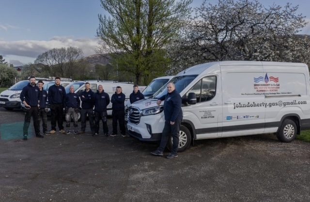 The John Doherty and Co Ltd team with part of their fleet of vans, a Trading Standards vetted West Dunbartonshire Trusted Trader