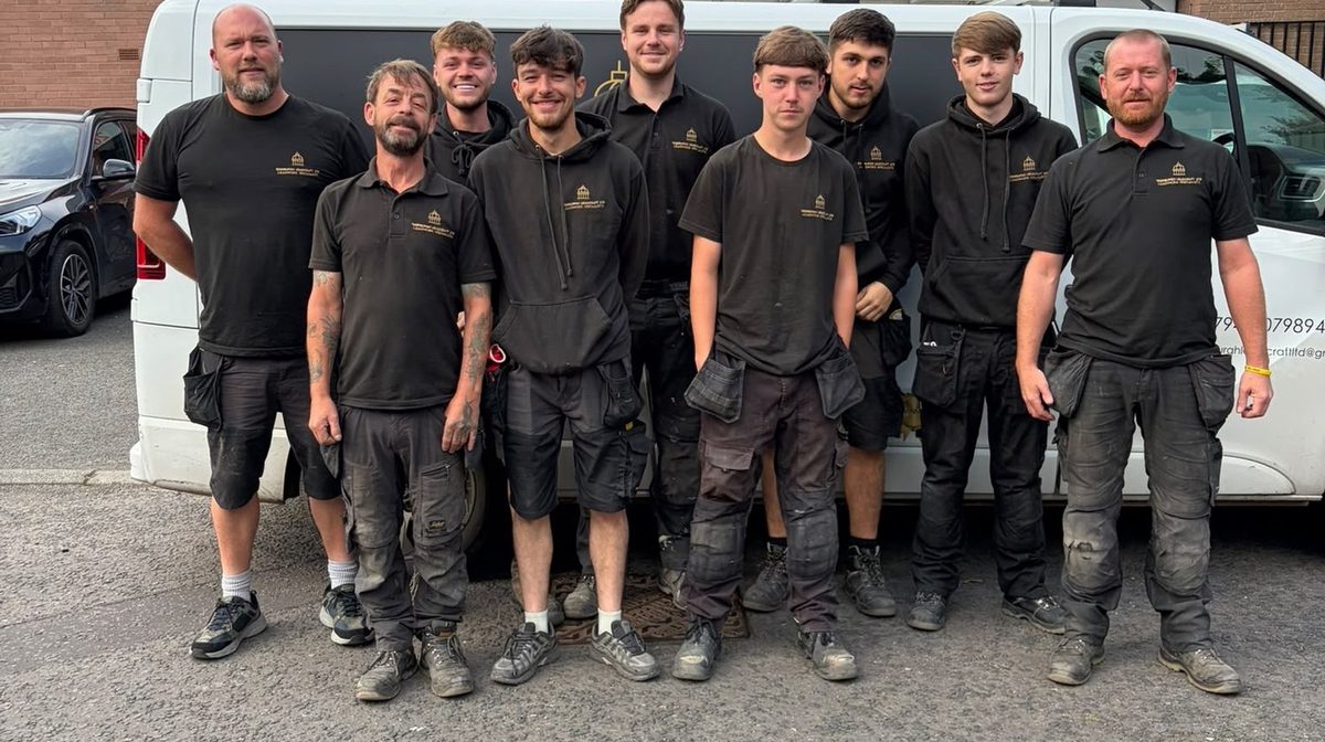 The nine strong Edinburgh Leadcraft team standing in front of a company van, a Trading Standards vetted Edinburgh Trusted Trader