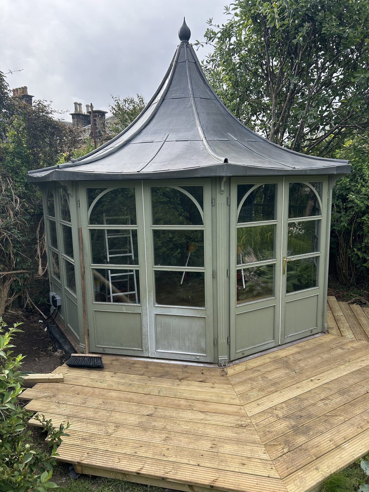 A garden pavilion with a new hand formed lead roof and a lead finial, built by Edinburgh Leadcraft