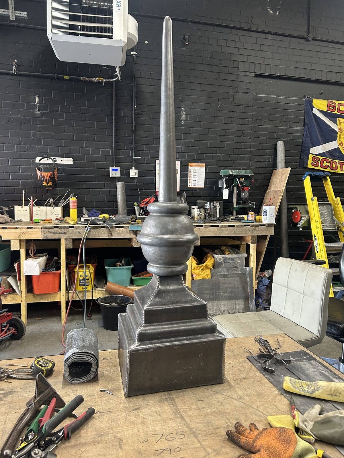 A tall lead finial made up by hand on the bench in the Edinburgh Leadcraft workshop