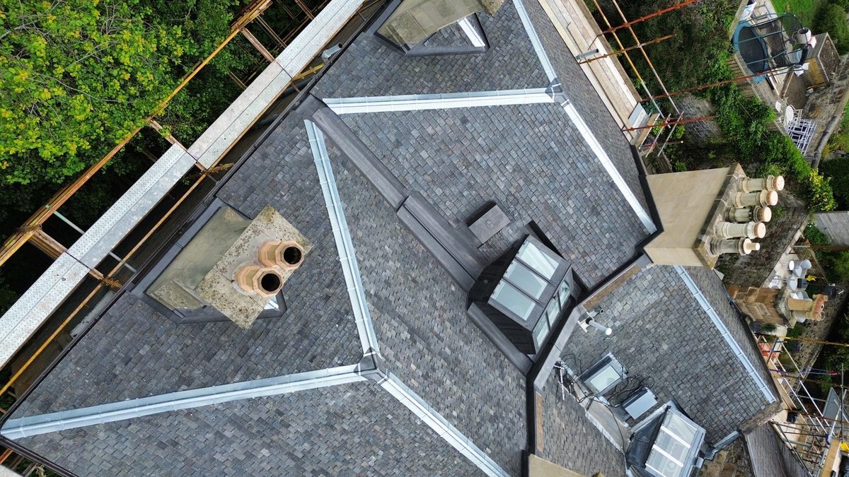 A completed slate roof seen from above, with new lead hips, ridges and valleys by Edinburgh Leadcraft