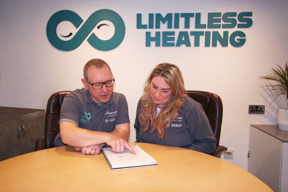 Allan Melville reviewing the week's work with a colleague at the Limitless Heating office in Dalkeith