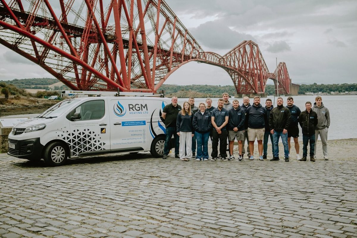 The RGM Heating Ltd team with a branded van at the Forth Bridge, Fife Trusted Trader member